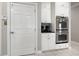 Kitchen with white cabinets, double ovens and granite countertop at 204 5Th Ave. N, North Myrtle Beach, SC 29582
