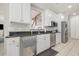 Kitchen with white cabinets, granite counters, and stainless steel appliances at 204 5Th Ave. N, North Myrtle Beach, SC 29582