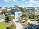 Aerial view of a charming beach house with large driveway and landscaping at 204 5Th Ave. N, North Myrtle Beach, SC 29582