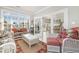 Bright sunroom features wicker furniture and access to the backyard at 204 5Th Ave. N, North Myrtle Beach, SC 29582