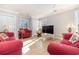 Relaxing living room featuring red sofas and a flat-screen TV at 204 5Th Ave. N, North Myrtle Beach, SC 29582