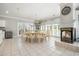 Large dining room with round table, fireplace, and ample natural light at 204 5Th Ave. N, North Myrtle Beach, SC 29582