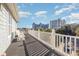 Deck overlooking the neighborhood with ocean views and white rocking chairs at 204 5Th Ave. N, North Myrtle Beach, SC 29582