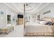 Luxurious main bedroom with a king-size bed and access to the sitting room at 204 5Th Ave. N, North Myrtle Beach, SC 29582