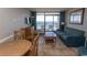 Living room with ocean view, sofa, and dining area at 6804 N North Ocean Blvd. # 933, Myrtle Beach, SC 29572