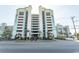 Oceanfront building exterior with parking and landscaping at 6804 N North Ocean Blvd. # 933, Myrtle Beach, SC 29572