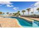 Resort-style pool with lounge chairs and palm trees at 5300 North Ocean Blvd. # 1405, Myrtle Beach, SC 29577