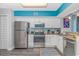 White kitchen with stainless steel appliances and granite countertops at 5300 North Ocean Blvd. # 1405, Myrtle Beach, SC 29577