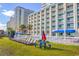 Hotel style exterior with relaxing lawn and picnic tables at 5300 North Ocean Blvd. # 1405, Myrtle Beach, SC 29577