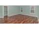 Spacious bedroom with wood-look flooring and ample closet space at 676 Oxbow Dr., Myrtle Beach, SC 29579