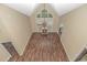 High-ceiling living room with hardwood floors, fireplace, and two ceiling fans at 676 Oxbow Dr., Myrtle Beach, SC 29579