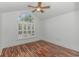 Bright bedroom featuring a large arched window and wood flooring at 676 Oxbow Dr., Myrtle Beach, SC 29579