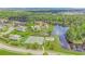 Aerial view of community with lake, tennis courts, and homes at 676 Oxbow Dr., Myrtle Beach, SC 29579