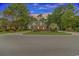 Brick home with a beautiful, tree-lined streetscape at 676 Oxbow Dr., Myrtle Beach, SC 29579