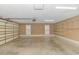 Spacious garage with overhead door and built-in shelving at 676 Oxbow Dr., Myrtle Beach, SC 29579