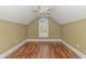 Bedroom with vaulted ceiling, arched window and wood flooring at 676 Oxbow Dr., Myrtle Beach, SC 29579