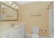 Bathroom with a vanity, toilet and large mirror at 676 Oxbow Dr., Myrtle Beach, SC 29579