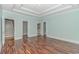 Light and airy bedroom with wood flooring and access to a private bathroom and staircase at 676 Oxbow Dr., Myrtle Beach, SC 29579