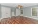 Spacious bedroom with wood flooring, double closets, and two windows at 676 Oxbow Dr., Myrtle Beach, SC 29579