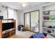 Bedroom with TV, sliding door to patio, and shelves at 336 Piedmont Ave., Myrtle Beach, SC 29577