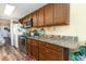 Kitchen with granite countertops and wood cabinets at 200 76Th Ave. N # 411, Myrtle Beach, SC 29572
