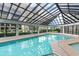 Indoor swimming pool with a glass roof and plenty of natural light at 200 76Th Ave. N # 411, Myrtle Beach, SC 29572