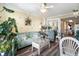 Living room with comfy couch, coffee table, and lots of plants at 200 76Th Ave. N # 411, Myrtle Beach, SC 29572