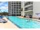 Resort-style pool area with plenty of lounge chairs for relaxation at 200 76Th Ave. N # 411, Myrtle Beach, SC 29572