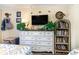 Bedroom featuring a dresser, TV, and a bookcase filled with books at 200 76Th Ave. N # 411, Myrtle Beach, SC 29572