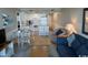 Open living room and kitchen with dining area, featuring a comfy couch and hardwood floors at 601 Retreat Beach Circle # 524, Pawleys Island, SC 29585
