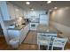 Well-equipped kitchen with granite countertops and white cabinetry at 601 Retreat Beach Circle # 524, Pawleys Island, SC 29585