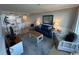 Bright living room with a navy blue couch and white accent chairs at 601 Retreat Beach Circle # 524, Pawleys Island, SC 29585