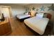 Second bedroom with two twin beds and a dresser at 601 Retreat Beach Circle # 524, Pawleys Island, SC 29585