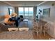 Living room with ocean view and comfortable seating at 601 Retreat Beach Circle # 524, Pawleys Island, SC 29585