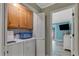 Laundry room with washer, dryer, and built-in shelving at 504 13Th Ave. S, North Myrtle Beach, SC 29582