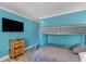 Bedroom with full-size bed, bunk bed, dresser, and wall-mounted TV at 504 13Th Ave. S, North Myrtle Beach, SC 29582
