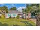 Charming house with teal shutters and palm trees at 504 13Th Ave. S, North Myrtle Beach, SC 29582