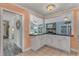 Kitchen features granite countertop breakfast bar, white cabinets, and view into living area at 504 13Th Ave. S, North Myrtle Beach, SC 29582