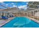 Inviting screened pool with lounge chairs, ideal for relaxation and entertainment at 504 13Th Ave. S, North Myrtle Beach, SC 29582