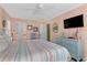 Bright bedroom with a king-size bed and flat-screen TV at 504 13Th Ave. S, North Myrtle Beach, SC 29582
