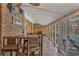 Sunroom with tiled floor, wooden walls, and pool view at 504 13Th Ave. S, North Myrtle Beach, SC 29582
