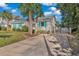 Cute house with teal shutters and gated driveway at 504 13Th Ave. S, North Myrtle Beach, SC 29582
