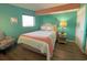 Bedroom with a full bed, teal walls, and coastal decor at 7100 Ocean Blvd. N # 919, Myrtle Beach, SC 29572