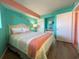 Bedroom with a queen bed and teal walls at 7100 Ocean Blvd. N # 919, Myrtle Beach, SC 29572