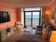 Ocean view living room with L-shaped sofa and comfortable seating at 7100 Ocean Blvd. N # 919, Myrtle Beach, SC 29572