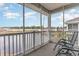 Relaxing screened balcony overlooking a lake and community at 332 Kiskadee Loop # L, Conway, SC 29526