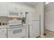 Clean kitchen with white appliances and cabinetry at 332 Kiskadee Loop # L, Conway, SC 29526