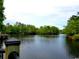 Serene view of a calm river with lush vegetation at 332 Kiskadee Loop # L, Conway, SC 29526