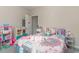 Cozy bedroom with a playful atmosphere, featuring a bed with colorful bedding and various toys at 332 Kiskadee Loop # L, Conway, SC 29526