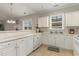 Well-equipped kitchen with white cabinets and ample counter space at 332 Kiskadee Loop # L, Conway, SC 29526